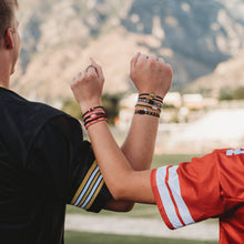 Load image into Gallery viewer, K'lani hair tie bracelets - University of Wisconsin Game Day Hair Tie Bracelets